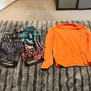 Orange Rash Guard and Patterned Swim Shorts